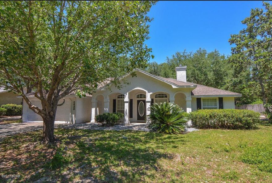 Centrally located home just off of 23rd St. Nestled on large shaded lot and within walking distance to restaurants and shops. Large open floor plan with fireplace, high ceilings, recess lights, crown molding, spacious bedrooms and office. Kitchen features island, breakfast bar, pantry and lots of cabinets and counter space. Vaulted ceiling in master bedroom. Walk In closet, double vanity, garden tub and separate shower in master bath. Nice covered porches for relaxing outside and grilling out.