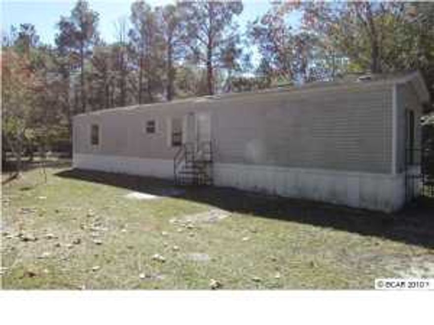 *EQUAL HOUSING OPPORTUNITY* Over an acre of serenity awaits you! Gorgeous private setting offers country living at its best! Large living room is great for guests steps from the over sized kitchen. Tons of cabinetry and coutner space along with a breakfast bar. Home has ceiling fans, sliding glass doors, large closet space and an open floor plan. So much potential: do not miss this gem! Great location. Near downtown Pamama City, Deer Point Lake, Hwy 231and Campflowers Rd.