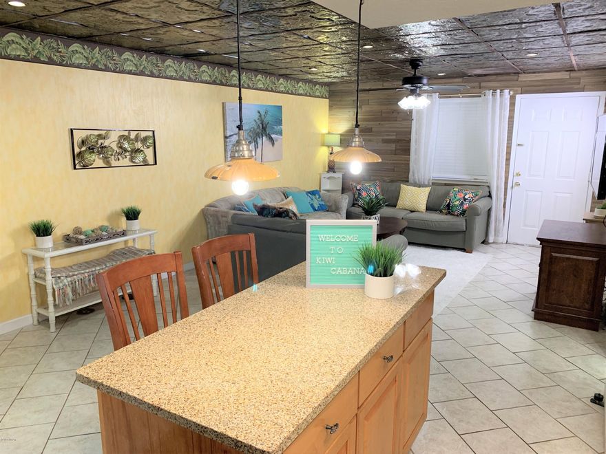 /*/*/  The KIWI CABANA  / */*/--- Beach Townhouse only 1 BLOCK from the white sand!! ---SHORT TERM VACATION RENTALS ALLOWED--- Incredible investment opportunity in Central Panama City Beach. This 2BR / 1.5BA FULLY FURNISHED property is in a small private townhouse community with a private pool and private green space common areas. This unit grossed approx $35K  in 2019 in it's first year on the rental market. Similare properties in the complex are producing similar numbers, some up to $50K last year (Numbers in documents section) --Unit is currently on the short term rental market and has bookings already reserved so income begins immediately. --