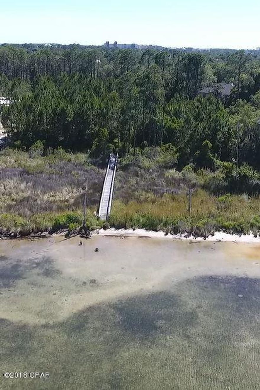 Imagine waking every morning to gorgeous views of St. Andrews Bay. Build your perfect home on this large waterfront lot just under an acre. Ultimate privacy at the end of a cul-de-sac and located in the gated community of The Preserve on The Bay. Fantastic location in Panama City Beach just minutes from the beach, restaurants, golf courses, marinas, shopping, & much more.