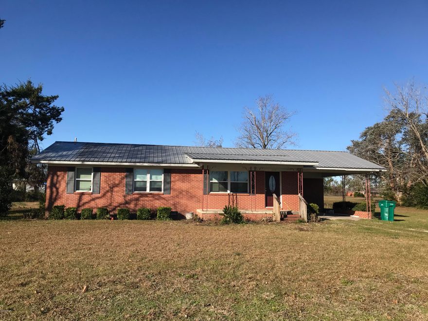 VERY MOTIVATED SELLER.  $20,000 Price Reduction.  Bring all offers.    If you want convenience, this home is for you!  3 BR/1 & 1/2 bath bath home located across from Dollar General &  within walking distance to Post Office, Grocery Store, & Schools.  Huge family room, carport, & storage shed in back yard.  Windows & doors replaced 4 yrs. ago   Completely required & has a 9 year old roof.  Make an appt. today to view.