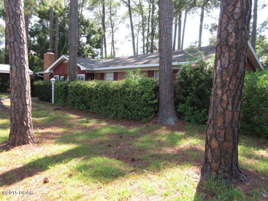 Very nice, 3 BR, 2 bath, Brick Home.  On entering, you will notice that the front porch has been enclosed to create a Sun Room, great for your plants.  this home features a large Living room, a dining area convenient to the kitchen, a Bonus room accessed though French Doors.  A spacious Family room has a wood burning fireplace set in a custom natural stone hearth.  Large Master Bedroom and private Master Bath.  Two additional bedrooms, all with ceiling fans.  The ample back yard has been fenced for privacy and there is an open concrete patio for entertaining.  There is a large storage building with power and a smaller yard shed.  This home is convenient to the shopping and dining on 23rd Street and Downtown Panama City.  It is just minutes from the beautiful beaches of Panama City Beach