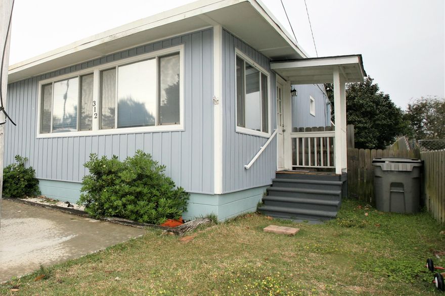 Make this adorable beach cottage yours! Have you ever dreamed of walking to the beach from your very own beach home? Make that dream a reality with 312 Rose Ln. This home is only three blocks from the beach in a highly sought after community! Convenient to Pier Park, the theater, the Hathaway Bridge, and Hwy 98. Easy care hardwood floors, fresh paint, and a new shed has been added in the backyard. Parking repaved. Flat fenced lot and sprinkler system.