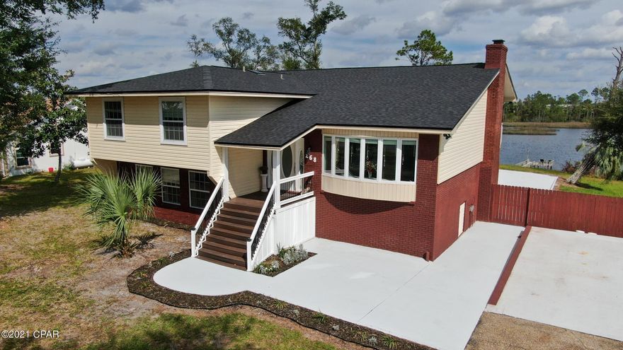 Over 100ft of water frontage. Located on Callaway Bayou which leads to the Gulf of Mexico! All the waterfront luxuries and NOT in a flood zone! (flood zone X). Fully updated. New updates include new roof, kitchen cabinets, appliances, updated bathrooms, and A/C. This 5 Bedroom, 3 bath home offers a spacious formal living and dining room for entertaining. Enjoy your afternoons sitting on the wrap around porch! When you are ready to hit the water just walk down to your very own private dock! Have peace of mind with a 1 Year home warranty!