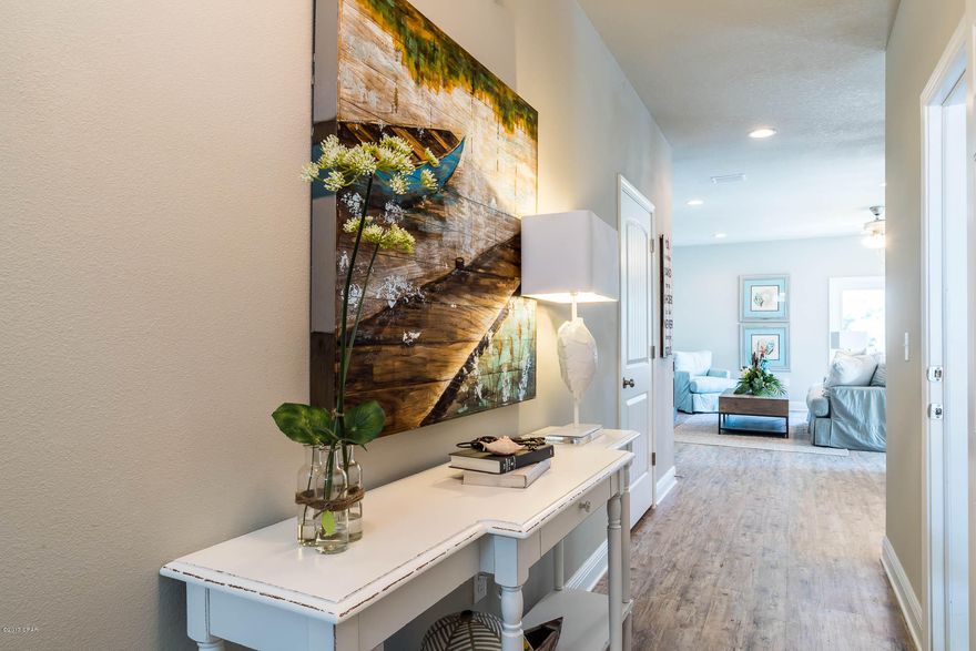 Gorgeous 3 bedroom, 2.5 bath townhome features Ivory cabinets, Azul Plantio Granite and Weathered Barnwood vinyl flooring.  BACKING TO THE CONSERVATION AREA - this location is breath taking.  The Whisper Dunes community offers a well appointed cabana and pool but the beach is only a 5 minute walk.