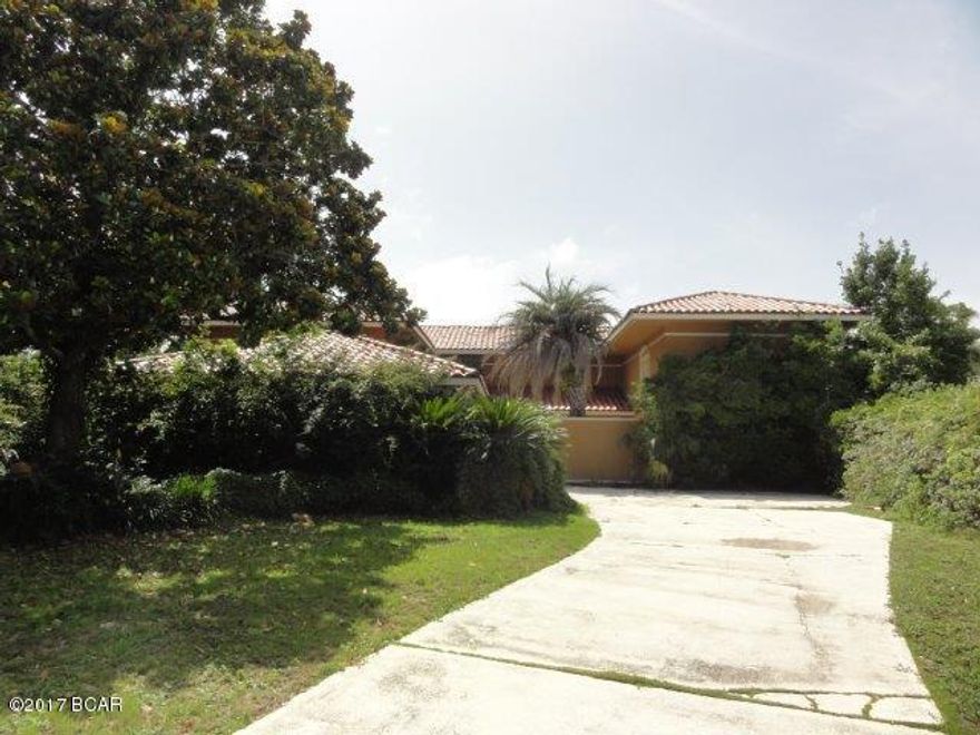 Beautiful Mediterranean style home on the Bay! Quaint court yard welcomes you into this one of a kind home! Main level features formal living room with FP & wet bar, open dining room with crystal chandelier, wood paneled family room with FP & wet bar, kitchen boasts stained cabinets, breakfast area and large island! Guest quarters on main level with 3 bedrooms, each w/ private baths! Oversized master bedroom upstairs with sitting room, FP, huge walk-in closet, and balcony overlooking the Bay! Master bath features steam shower and Jacuzzi tub! Two secondary bedrooms upstairs! Large bonus room with built in bookcases and bay window! Library/trophy room with spiral staircase and elevator to family room! Plenty of storage & custom finishes! Large patio, in-ground pool and spa, as well as a 100 feet of deep-water dockage! Breathtaking views!