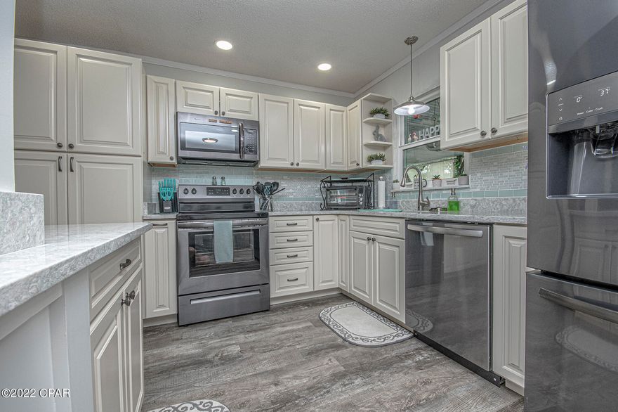 'CURRENTLY UNDER CONTRACT, SELLER WILL CONSIDER BACKUP OFFERS' WOW!!  Your Ocean Oasis awaits!  This 5 bedroom 3.5 bathroom beach house has been gutted to the studs & completely RENOVATED/RECONSTRUCTED!  First floor offers spacious open floor plan, LVP flooring throughout, first floor master bedroom with large WALK IN closet and master bathroom, additional half bath for guests located off living room.  Kitchen is IMMACULATE with the most beautiful quartz countertops and tile backsplash, all new appliances.  Upstairs you will find 4 spacious bedrooms and two full bathrooms.  Enormous balcony runs the full length of the home in back providing a large shaded outdoor entertainment area on the ground level complete with an outdoor sink, 2 outdoor showers and an outdoor tub! The backyard boats a brand new above ground pool with deck and two large storage sheds that are temperature controlled.  ***Attention investors**** This home is only 3 blocks to the World's Most Beautiful Beaches and 1 block from the lagoon w/ boat launch!  Rental projections 85-125k!!!  This home is already set up for entertaining and would make a phenomenal AirBnB. Within 5 minutes to family fun park, waterpark, restaurants, shopping, boat and jet ski rental, scooter/atv rental, bike rental, zoo, para sailing, helicopter rides and so much more!!!  YOU MUST SEE AND FEEL WHAT THIS AMAZING PROPERTY HAS TO OFFER!!  Contact your realtor TODAY!