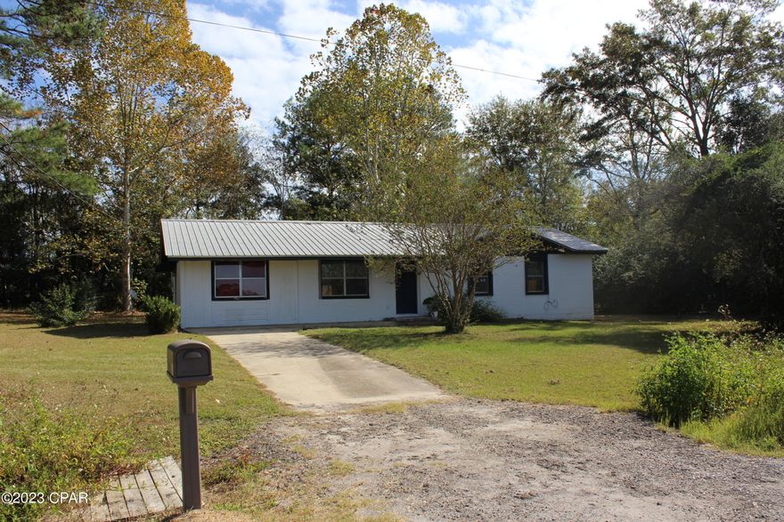 Features of this concrete block home include 3 bedrooms, one bath, and a bonus room sitting on one acre with a yard building.

Does need flooring, paint and a few repairs.  Call today to set up your private viewing.