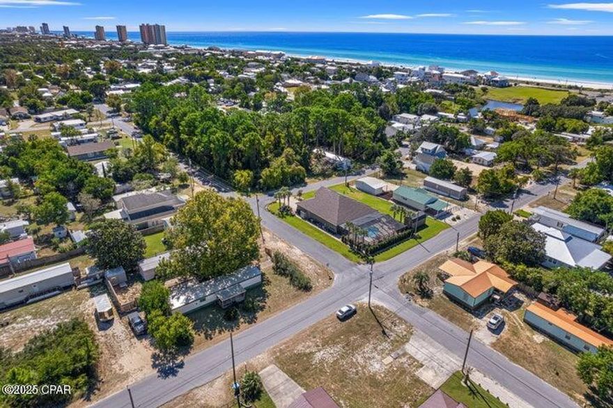 Rare Opportunity in Laguna Beach less than 2,000 feet to the Beach Access and Gulf.  This property is a double lot with a parking driveway behind the residence, and a screened in deck. Property like this doesn't come around very often.  This would be a perfect family vacation getaway located close to all the amenities of Panama City Beach and just 4 miles to Pier Park.

All measurements to be verified by buyer.