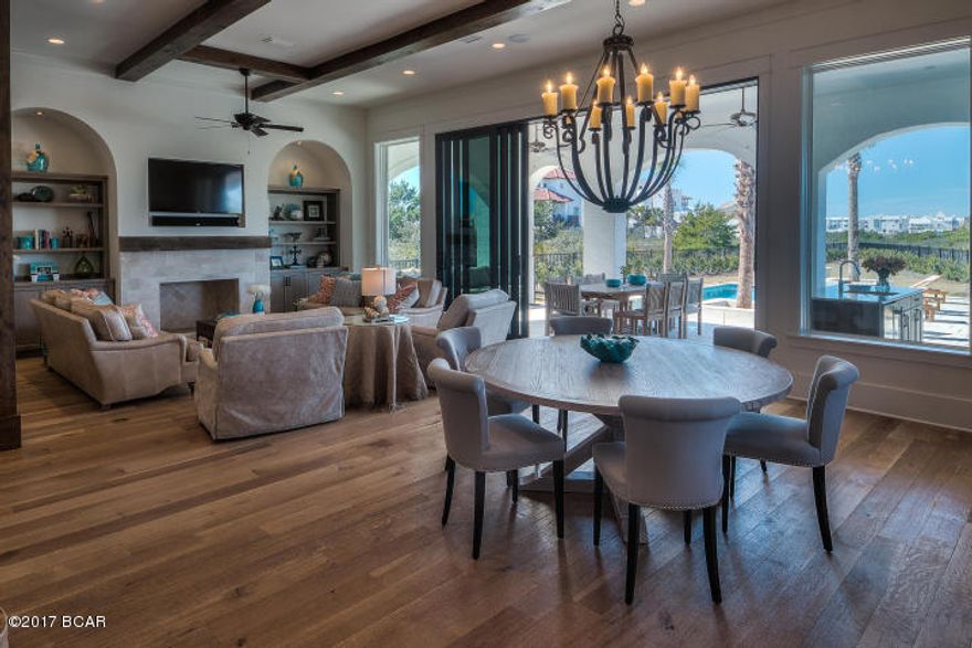 Paradise by the Sea designer home. $224k Rental Projection. Fully Furnished 5BR & 7BA, turn key, and move in ready. 4 large ensuite bedrooms + bunk room with private bath. Oversized 3-car attached garage with ample storage. Deeded beach access. 1/4 acre lot with new privacy wall surrounding the heated pool, spa, and courtyard. Over 7,000 square feet under roof with amazing gulf views from the 2nd and 3rd floor enormous balconies. Slider door opens living area to the poolside oasis & summer kitchen. Smart technology through out. Every bedroom and bunk room has a private bath room. Ample storage space in attic and 3-car garage. Every aspect of this home is custom designed to be a One of Kind. 6 passenger golf cart and Young Chang baby grand piano included.