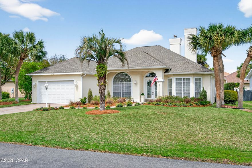 Bright, spacious, and ready for coastal living - this Palm Bay 4BR/2BA pool home offers a private backyard oasis and a location just minutes from Panama City Beach's beaches, marina, dining, and shopping.

Step inside the 12-foot foyer with leaded, beveled glass doors to discover a light-filled interior with solid flooring throughout, including pickled oak hardwood and tile in the kitchen and baths. The living room features a fireplace with a custom mantel flanked by built-in bookcases.

The kitchen is designed for both style and function, with abundant cabinetry and Kitchenaid stainless appliances. Major updates include a gas range connection added in 2022, along with a new stove, oven, microwave, dishwasher, and sink/faucet, plus a refrigerator replaced in 2025.

The primary suite is a private retreat featuring its own fireplace, LVP floors, and a luxurious bath with a cultured marble double vanity, whirlpool tub, separate walk-in shower, and a stained glass window.

Sliding glass doors lead to a covered lanai overlooking the in-ground pool with a screened enclosure. The backyard is lush and professionally landscaped, creating a serene, garden-like setting with plenty of privacy.

Additional features include an extra-large 2-car garage with its own AC, a 2019 roof, and a 2022 HVAC system. 

Don't miss the chance to experience this exceptional home - schedule your private showing to see everything it has to offer.