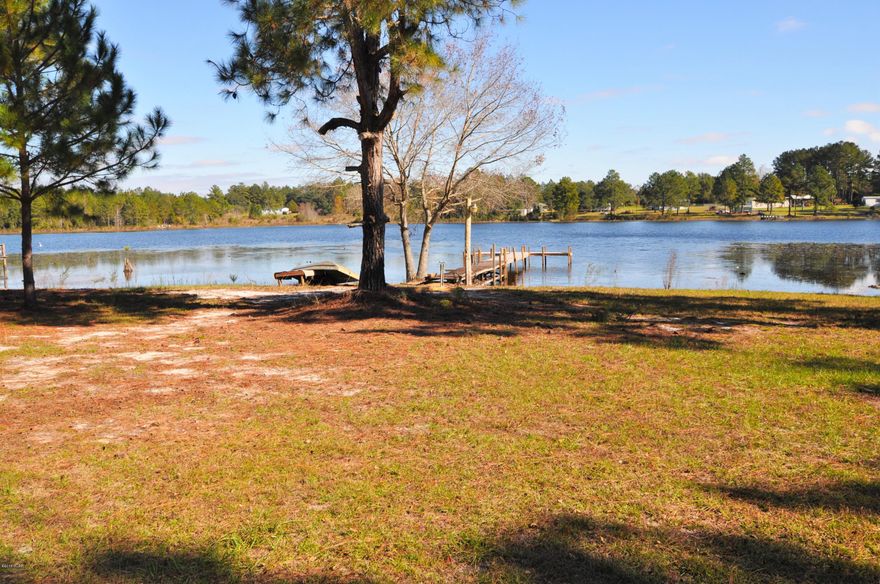 AWESOME WATERFRONT Home with Dock on 3.5 Acres. Well Kept 3 bedroom home with huge added back room. This lake is loaded with bass.. Bring your boat and catch dinner...or just relax and watch the fish jump and listen to the quietness of this quaint country setting. You have over 300' of lakefront relaxation......all sizes are approximate please measure if important to you..