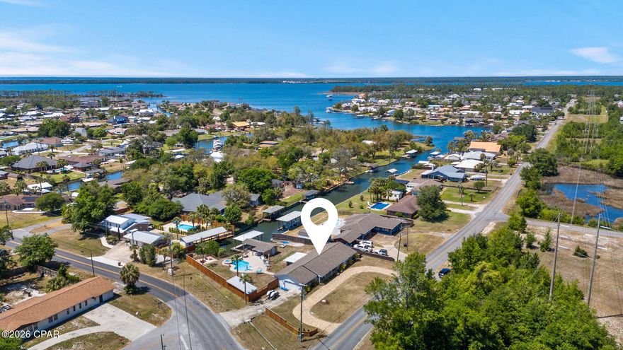 Canal Front home with Gulf water access- Beautiful all-brick waterfront home on large corner lot located in the Northshore area. Open floor plan, large Master Bedroom with large Walkin closet with shelving and organizers. Large, fenced backyard with heated swimming pool, hot tub, very cute boat house/playhouse and deck with boat lift overlooking canal. There is a private boat launch directly from back yard into the canal. Lots of parking with both side drive and circular front drive with pavers. Wonderful Home. Bring your Boat and move in!