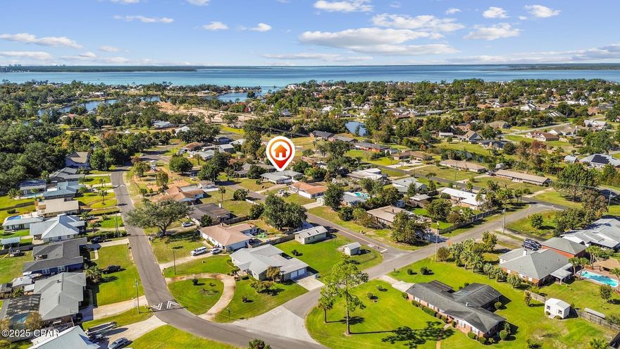 Welcome to a spacious 4-bedroom home in the heart of Panama City, offering over 2,400 square feet of living space on a generous 0.32-acre lot. Located in Island View Estates and directly across the street from a community park, this property combines an incredible location with strong investment potential. Whether you're searching for a home to update to your taste or looking for your next rental/flip opportunity, this one offers exceptional space and value.

Inside, you'll find a large living room filled with natural light, a dedicated dining area, and a bright kitchen with ample cabinet storage. The adjoining Florida Room creates additional flexible space for casual lounging, hobbies, or play. The primary bedroom features a walk-in closet and an en-suite bath with double vanities and a step-in shower, while three additional bedrooms and a separate office provide room for work, guests, or multigenerational needs.

The fully fenced backyard includes a detached shed for storage, plus plenty of room for a garden, outdoor seating, or future improvements. An oversized driveway accommodates multiple vehicles, RV parking, or a boat—ideal for enjoying the nearby public boat ramps that take you straight into North Bay.

This home is just 1 mile from University Academy and The Shops at SweetBay, placing restaurants, walking trails, waterfront views, and community events within minutes. Schools, health care, and major roadways are also close by, offering everyday convenience.

With solid structure, generous square footage, and a location that's hard to beat, this property is ready for its next chapter. A great opportunity for investors or buyers looking to update a home to fit their own style—schedule your showing today.