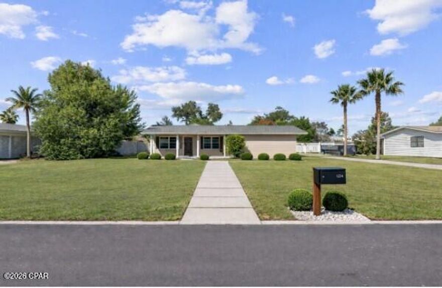 Welcome to this spacious 4-bedroom home in the heart of Panama City, offering over 2,400 square feet of living space on a generous 0.32-acre lot. Located in Island View Estates and directly across from a community park, this property pairs an excellent location with strong investment and lifestyle potential. Whether you're looking to customize a home to your taste or secure your next rental or flip opportunity, the space and versatility here truly stand out.

Inside, the home features a large, light-filled living room, a dedicated dining area, and a bright kitchen with abundant cabinetry. The adjoining Florida Room adds valuable flexible space—perfect for casual entertaining, a playroom, or hobbies. The primary suite includes a walk-in closet and an en-suite bath with double vanities and a step-in shower. Three additional bedrooms plus a separate office provide plenty of room for guests, remote work, or multigenerational living.

Out back, the fully fenced yard offers even more opportunity. In addition to a detached storage shed, there is a separate building located at the rear of the property with plumbing and electrical already installed, making it ideal for a potential guest suite, home office, workshop, studio, or future income-producing space (buyer to verify permitted use). The yard also provides ample room for gardening, outdoor seating, or future enhancements.

An oversized driveway allows for multiple vehicles, RV parking, or boat storage—perfect for taking advantage of nearby public boat ramps with direct access to North Bay.

Conveniently located just one mile from University Academy and The Shops at SweetBay, this home offers easy access to dining, shopping, walking trails, waterfront views, and community events, with schools, healthcare, and major roadways close by.

With solid bones, generous square footage, and an unbeatable location, this property is ready for its next chapter. An excellent opportunity for investors or buyers seeking space, flexibility, and value—schedule your showing today.