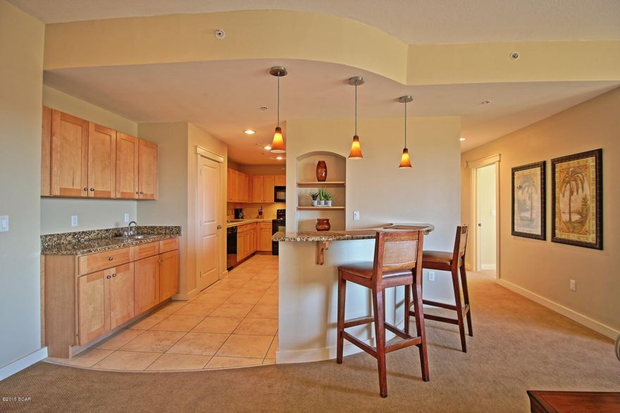 This rare gem features one of the most unique condo floor plans in Panama City Beach! One of only two in beautiful Origin at Seahaven. Located on the pool amenity level, this layout has two large private terraces to accommodate small events and would make a perfect home, second home, rental investment, party pad or hospitality suite. Gulf and sunset views! Fully furnished, turn-key rental ready condo. There is a built-in wet bar and an additional large circular bar seating area with pendant lighting in the oversized Great Room. Huge U-shaped kitchen with every desired amenity. This is the only two bedroom floor plan in Origin with 2 1/2 baths. There is a large walk-in closet in the Master. The largest private patio opens into the common area dining terrace with commercial grill. If you haven't seen Origin at Seahaven yet, you have missed one of the best built condos in Panama City Beach! No other resort condominium in this market features hotel design cues...a large entrance motor court, luxurious lobby, and interior corridors with African Mahogany entrance doors and custom logo sconces. Sunrise and Sunset Terraces on the 15th floor are perfect for your reception or special event. Your family will love the Bamboo Room Theater, Grand Pool Terrace with heated zero-entry pool and hot tub, dining terraces with commercial stainless grills, and the convenience of in building parking and available onsite rental management. ALL INFORMATION CONTAINED HEREIN IS DEEMED RELIABLE, BUT NOT GUARANTEED. SUBJECT TO ERRORS, OMISSIONS, PRIOR SALE, CHANGES OR WITHDRAWALS WITHOUT NOTICE.