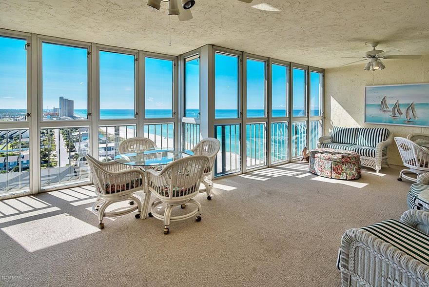Incredible opportunity to own one of the largest Gulf front units on the coastline! Regency Towers Unit 1414 is a beautiful penthouse offering a total of 3,224 square feet, including the 572 sq. ft. enclosed balcony (h&c). This was originally one condominium, but has been combined with another unit and converted into a spectacular space that is sure to impress. This is a 3-bedroom, 3-bath unit offering a large living area, expansive enclosed balcony with incredible Gulf views and an open floor plan with raised ceilings and thick crown molding. The unit is being sold fully furnished and the decor was recently updated for a coastal look. The kitchen and dining area is very spacious and open with wood flooring, classic columns, ample cabinets and a island with seating for more casual dining.