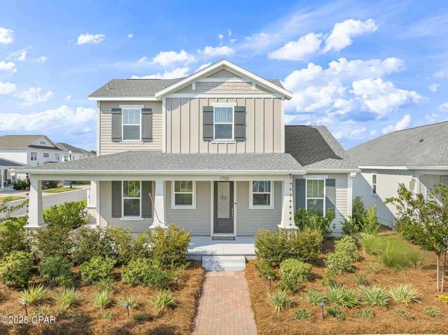 CURRENTLY UNDER CONTRACT, SELLER WILL CONSIDER BACKUP OFFERS, Welcome to this beautifully maintained 4-bedroom, 2.5 bath home nestled on a desirable corner lot with mature landscaping and excellent curb appeal. Spacious living, dining, kitchen area with luxury plank vinyl throughout. Primary suite on the main level offers comfort and convenience. On the second level, you will find 3 additional  bedrooms and a large loft, perfect for a home office, playroom, or media room.  Fenced yard with a 3-car detached garage and parking pad.  SweetBay is a walkable and golf cart approved community with resort styled pools, basketball and sports court, bay front beach, parks, playground and trails. The Town Center is open with a Publix and Starbucks with future businesses opening soon.