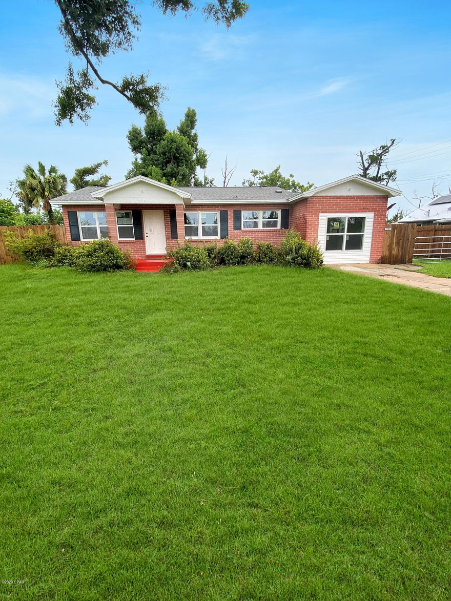 Check out this charming home located close to Tyndall Air Force base, restaurants, and shopping. The property is almost an acre with mature trees and fencing. The home has character like molding and a fireplace from the 50's however everything else is brand new. Water heater, roof, windows, and doors all new! There is an additional living area with a separate entrance along with a bedroom and bath, perfect for a possible renter. Schedule a showing today this home won't last long.