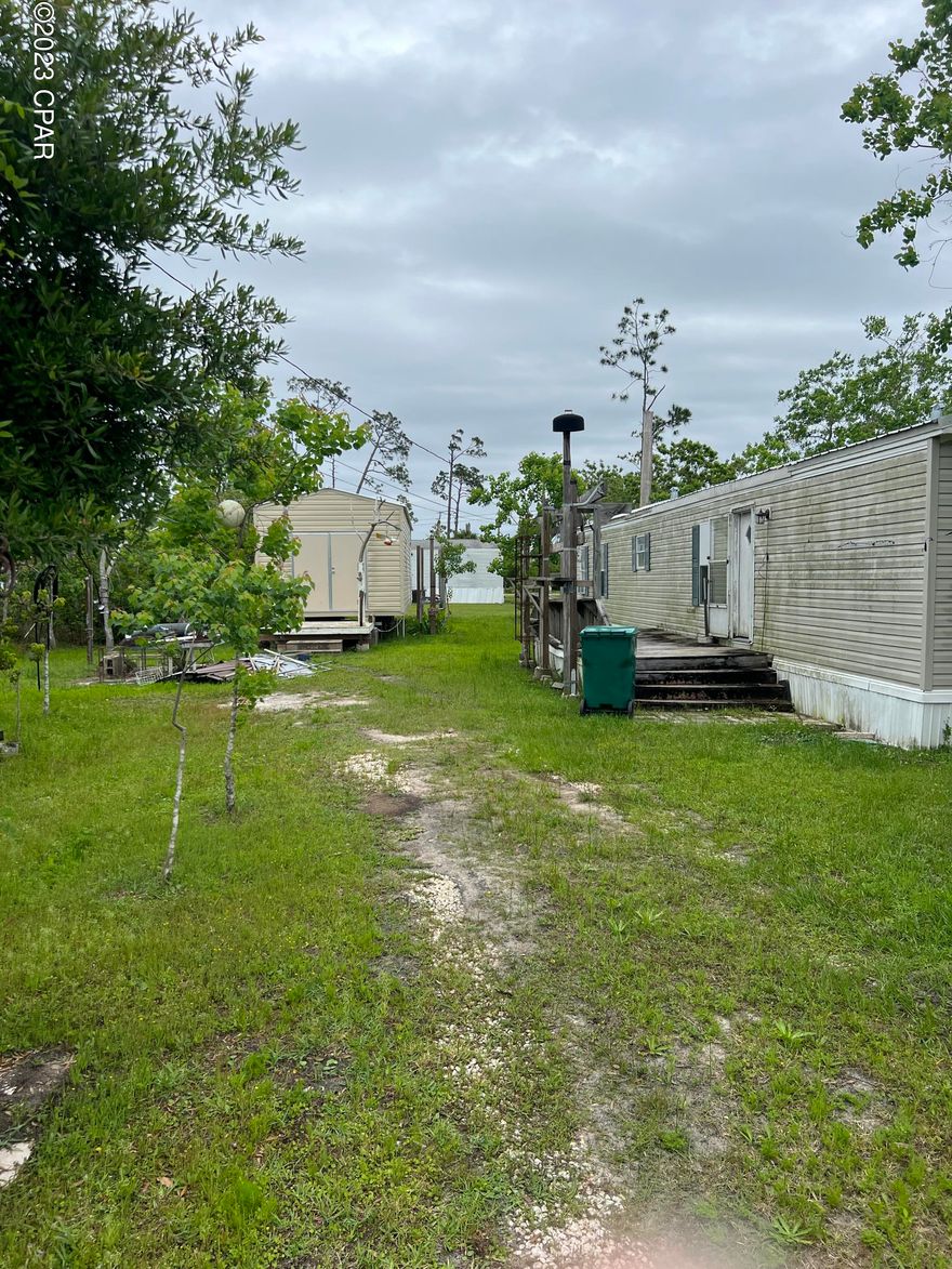 1995 single wide with detached shop/storage building. Easy walk to east bay!