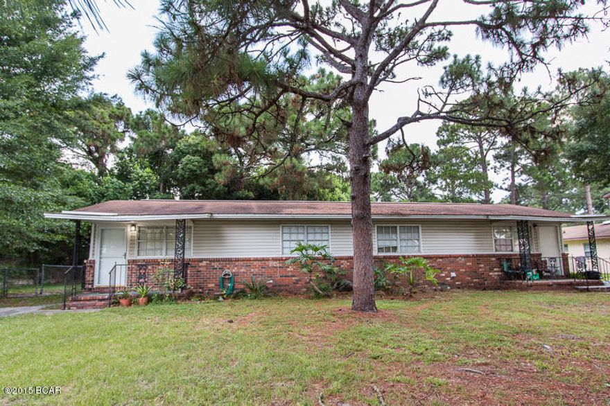 GREAT INVESTMENT! This property is currently bringing in $1,550 a month, with the potential to bring in more. The right side was recently updated with new floor and paint. It is being rented for $800/month. The left side (pictures are of this unit) is being rented for $750. Both are in very good shape and have large, fenced in back yards.  Both units are two bedroom, one bath. This duplex is located north of 23rd in a good neighborhood and very centrally located. Property is all electric and has city water. One lease will be up in just a few months so purchasing this to live in and rent one side out is a possibility. The rent from your tenant would cover your principal and interest payment!