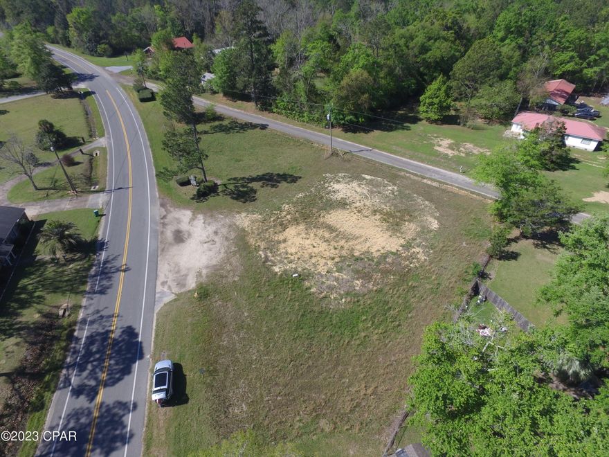 This property is located directly on Main Street and has road frontage on the back side of the property as well.  This triangular parcel is located at Main Street and 6th Avenue.  With great visibility, the possibilities are endless with this lot.  This parcel is mostly cleared and ready for its new owner!