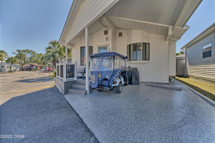 CURRENTLY UNDER CONTRACT, SELLER ACCEPTING BACKUP OFFERS. Turn key and ready for the beach!  Completely renovated within the last 18 months AND included is the golf cart, a gas/charcoal grill, beach chairs plus umbrella.  New luxury vinyl flooring throughout, new stainless kitchen appliances, granite countertops (bathrooms too).  Covered carport with trex deck flooring finish and night lights.  Venture Out is a golf-cart friendly resort with private beach access, two pools, private boat ramp/dock, fishing pier, tennis courts, shuffle board, mini-golf course and playground.