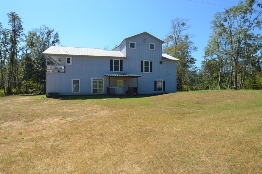 CURRENTLY UNDER CONTRACT, SELLER ACCEPTING BACKUP OFFERS. This large 3 story home offers a large living room with a wood burning fireplace located  on the second floor.  The kitchen has new wood vinyl plank and all new stainless steel appliances.  The dining room has double doors that open into a large Florida room.  The large master bedroom  is located on the third floor and has a sitting area.  The first floor is  framed up for 3 bedrooms, 2 baths, living room and kitchen area.  The first floor has its own entrance and could be used possibly as a rental unit.