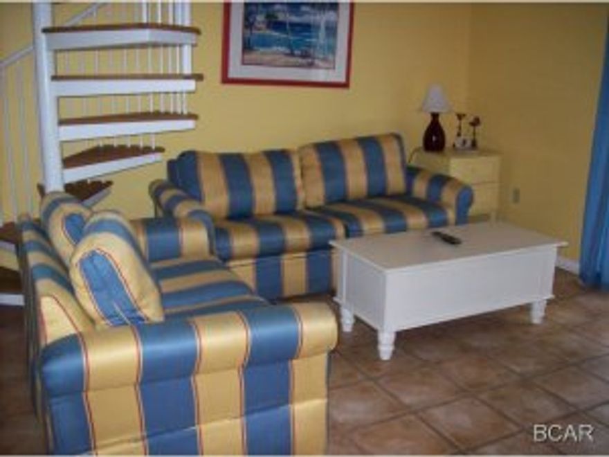 Fully furnished condo on the 3rd floor. Unit has a sprial staircase leading to the loft-style 2nd bedroom. Balcony overlooks the complex pool and Grand Lagoon.