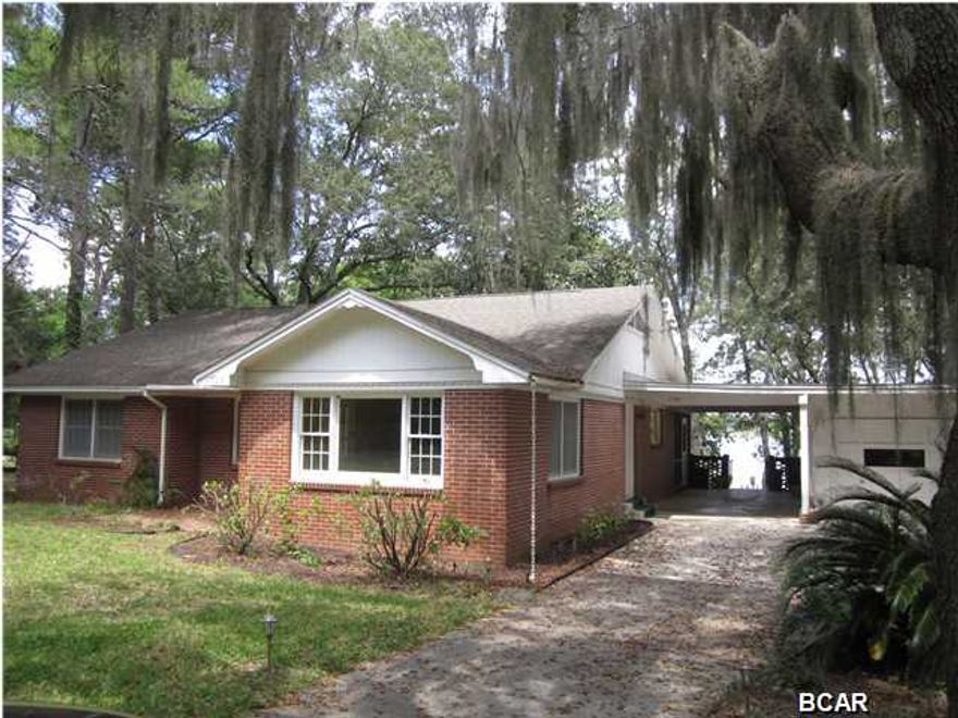 HUGE REDUCTION IN PRICE!!! DON'T MISS THIS ONE.... COVE WATERFRONT LIVING...WONDERFUL INVESTMENT...FANTASTIC WATSON BAYOU VIEWS....SITS ON OVER 1/3 ACRE LOT. BRING YOUR BOAT! THIS HOME COMES WITH A PRIVATE COVERED BOAT DOCK AND BOAT LIFT. A HUGE DECK AND SCREENED IN PORCH OVERLOOK THE BACK YARD AND BAY. THERE IS PLENTY OF PARKING WITH A DETACHED GARAGE AND CARPORT. ORIGINAL HARDWOOD FLOORS ARE THROUGHOUT! THE LIVING ROOM IS HUGE WITH WOOD BEAMS ON A CATHEDRAL CEILING. PLENTY OF LIGHT COMES IN THOUGH THE LARGE WINDOWS AND SKYLIGHTS. THE TOTAL SQUARE FOOTAGE IS 3191, INCLUDING THE FINISHED DAYLIGHT BASEMENT, WHICH HAS EXTRA SPACE FOR FITNESS EQUIPMENT, RECREATION ROOM OR A MAN CAVE. THIS HOME IS LOCATED ON THE HIGHEST ELEVATION IN THE COVE.