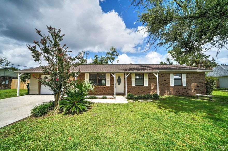 Move in ready, affordable Lynn Haven home. 3 bed 1.5 bath with a large fenced back yard and a  one car garage. All mold remediation and damages have been repaired. New windows will be installed prior to closing. Open living/dining/kitchen concept. New laminate flooring, paint, lighting, sheetrock, roof, etc. The kitchen features Corian countertops and stainless appliances. Close to many schools, shopping, boat ramp and public parks.