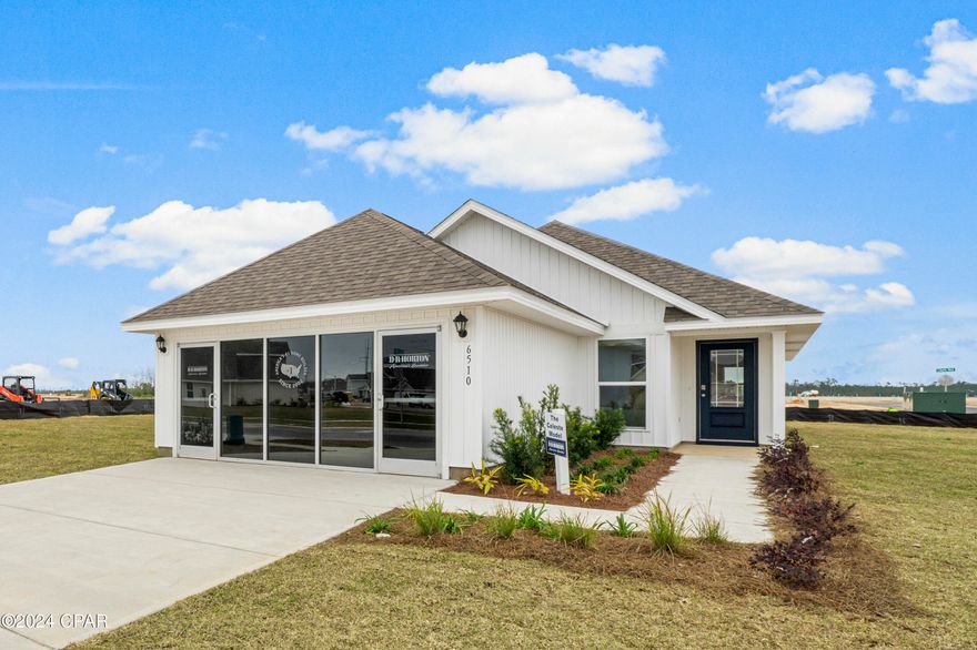 The Liberty Celeste model home at 6510 Canley Court is now for sale. This home is being sold as/is. Furniture does not convey.  All appliances currently in the home will convey and the warranty included will be for the time remaining on the item(s). Window treatments will not convey however all window hardware will remain. A one-year builder warranty will be included as well as a 10-year structural warranty, these will begin from the day of closing. Any sales center and glass doors will be removed, and the space will be reverted as shown on the floor plan. Upon entering the Celeste floorplan, you immediately notice the bright entry way afforded by the prairie door.  This 3-bedroom 2 bath, 1403 square foot home is an open floorplan.  The primary bedroom and bathroom are located off the entry at the front of the home.  The primary bathroom has double sink vanity, large shower, and a huge closet.  Proceed down the entry hallway passing the laundry area as you enter into the kitchen, dining, and family area.  The kitchen offers an island with space for bar seating.  On the opposite side of the home from the primary bedroom upfront, there are two spacious secondary bedrooms separated by another bathroom making this home a true split floorplan. Impeccable interior features include granite countertops, white cabinetry, EVP flooring throughout the common areas and carpet in each bedroom. This home also includes a stainless-steel appliance including a smooth top stove, microwave and dishwasher as well as a Smart Home Technology package with KwikSet keyless entry and a Qolsys touch panel that can be integrated to control your lighting, thermostat and even secure your home with a single touch. 
 Liberty neighborhood is conveniently located in beautiful Panama City off Star Avenue near 231. Located just 25 minutes from Tyndall Airforce Base, 20 minutes to hospitals, and less than 15 minutes to shopping, restaurants, and grocery stores you will be amazed at the convenience once you enter the winding entrance to this beautiful sanctuary. Liberty, D.R. Horton's premier new lifestyle community, offers a 7,500 square foot community center with full gym, wellness rooms and much more. Additionally, behind the community center is a water wonderland with resort style pool, splash pads, and an outdoor grilling kitchen with seating.