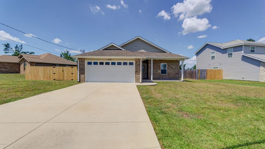 Well kept newer home in the Fox Lake subdivision across the street from a church. This home features three large bedrooms and two full baths with an open concept design and two care garage. The living room, back patio and master bedroom overlook a marshy lake making for a serene, quiet setting. The tiled kitchen features stainless appliances. The property is convenient to TAFB, shopping, dining and more. Well kept and like new, come see today!