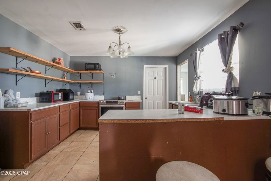 Remodeled 3-bedroom, 1-bath brick home featuring tile flooring throughout for easy maintenance and a clean, modern look. Cozy up by the fireplace in the inviting living area. Enjoy a spacious backyard, perfect for outdoor gatherings, pets, or gardening. Conveniently located near restaurants, grocery stores, and parks, offering both comfort and accessibility.