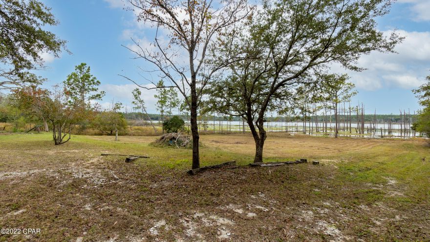 There is nothing to NOT love about this property!!! It has it all! Beautiful scenery, room for gardening, privacy, livestock, horses, campers, all your toys, boats, RVs you name it!!  Catch fish in your own private back yard! Home is move in ready and sits next to Water Management land so no neighbors on 3 sides  and tons of horseback riding areas///All fenced in with a separate pasture area. Not much on the market like this one especially at this affordable price!!

BUYER TO VERIFY ALL SIZES AND INFO///