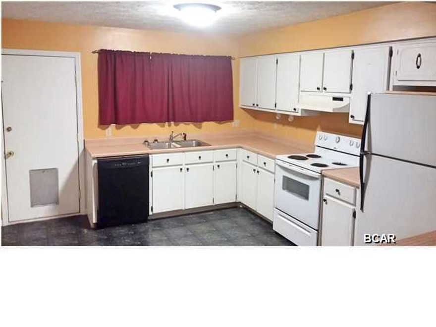 Centrally located end unit 2 bedroom, 1.5 bath Townhouse. Open feel where kitchen, dining and living room flows into one another. Inside laundry room with washer and dryer hook ups, and outside storage room. Large corner lot. Close to Parker School and Tyndall AFB. Age, Square Footage, and room sizes approx., if important please verify.