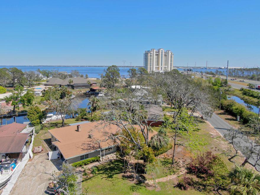 Located just minutes away from the beautiful Panama City beaches, this picturesque home is the perfect place to escape to. With a canal in your back yard that takes you right out to the Bay, it is ideal for the avid deep water fisherman (or woman). You have your own private dock with sea wall to house your vessel when not out exploring. Having an open floor plan, it has 4 bedrooms, 2 private baths and a separate bath for guests. This house is perfect for family or any guests who would like to take advantage of your close proximity to the airport and hours of entertainment. A large laundry room with folding station will make doing the chores a breeze, leaving you lots of time to have friends over to show off your Florida room. A large kitchen and dining room, with all kinds of cabinetry to house your good china, will make holidays less stressful and more enjoyable. Your new home has a family room with a beautiful, large, stone fireplace; the perfect place to lounge and relax after a long day. A secondary living room with fireplace will give you more space to stretch your legs. Located in the back of the house is a bonus room to make your own. With lots of large windows and several patio access sliding glass doors, this home shows off the beauty of your new neighborhood. All sizes are approximated and should be verified if important.