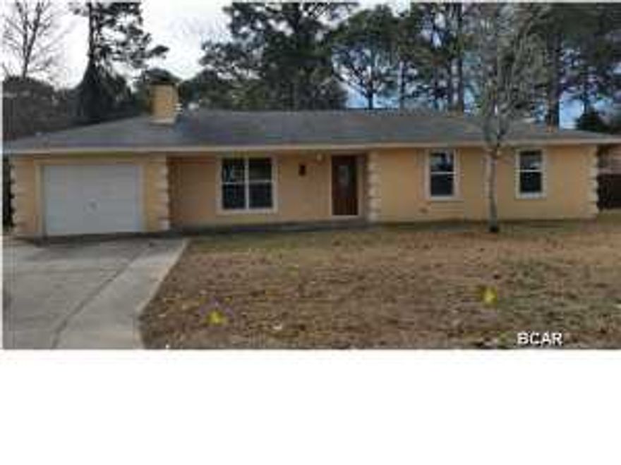 Best deal on the beach! This 3 bedroom 2 bath home located in North Lagoon Heights is sure to ''Wow'' you with its charm. Centrally located to the Navy Base, shopping, grocery, and beaches, North Lagoon Heights is a quaint neighborhood in the heart of Panama City Beach. The home features elegant, hand-scraped laminate wood floors throughout the living room, hallway and all three bedrooms. The master bathroom was recently updated with a large Jacuzzi tub with decorative ceramic and mosaic tile borders. The master bedroom overlooks the back yard and has a unique oil-rubbed bronze ceiling fan. Both additional bedrooms have been recently painted. The second bathroom has a tub/shower combination. Great for entertaining, the living room is spacious enough for a sectional or large furnishings