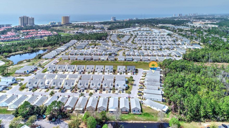 Ideal beach get-away, a starter home or income producing property. Beautifully tiled beach home featuring 1348 Sq Ft freshly updated three-bedroom two bath one-car garage is situated in a centrally located gated community of Palm Cove, less than a mile from the white sands of Gulf of Mexico. Vaulted ceiling and ample windows which makes for a spacious feel with abundant natural light. Updates include new roof (2020), new AC (2021), new water heater (2020), granite countertops, Samsung stainless steel appliances (2021), new tile flooring (2020), new kitchen cabinets (2020), kitchen backsplash, tiled walk-in master shower, stylish bowl sinks and vanity in primary bathroom. Enjoy large porch overlooking a wooded area. Serenity and peace.

Only minutes from the neighborhood's two pools, and main entrance with manned guardhouse. Ideal location with close proximity to the beach, Edgewater Shopping Plaza, Grand Panama Shopping Center, Lowes/Home Depot, Shipwreck Water Park, restaurants and entertainment. Management company keeps up your lawn, community pools and the front gate controlled. Short-term rentals allowed!