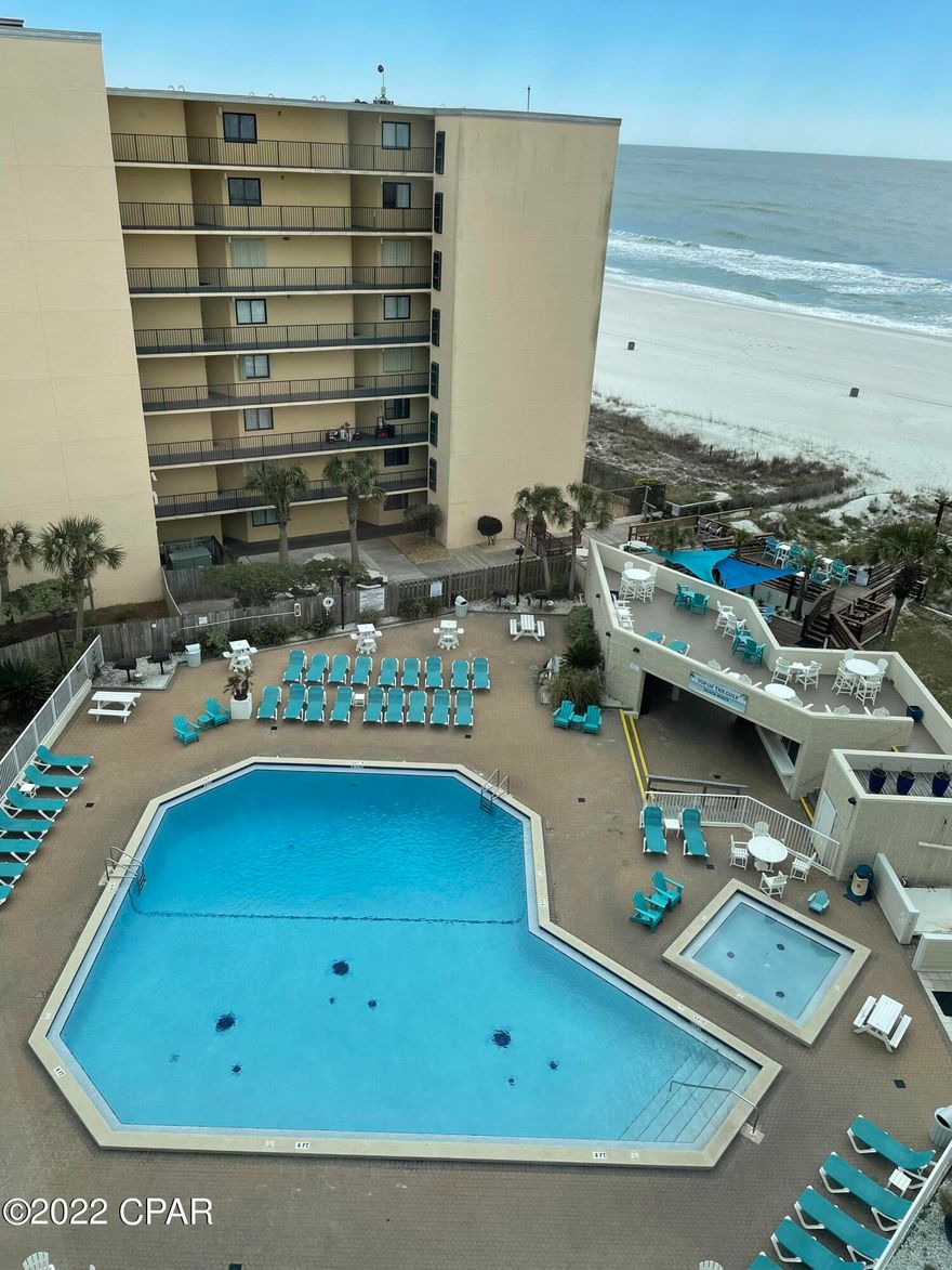 CURRENTLY UNDER CONTRACT, SELLER ACCEPTING BACKUP OFFERS Here is your opportunity to own a beachfront condo in Panama City Beach.  This is a studio condo on the 8th floor of Top of the Gulf Condos. Beautiful views as this unit faces the gulf.  Condo is fully furnished Just came off a long term rental. A must see for investors.  Keep it as second home and rent it the rest of the time.  Condo has numerous amenities, pool, kiddie pool.  Located on the top floor, no one above.