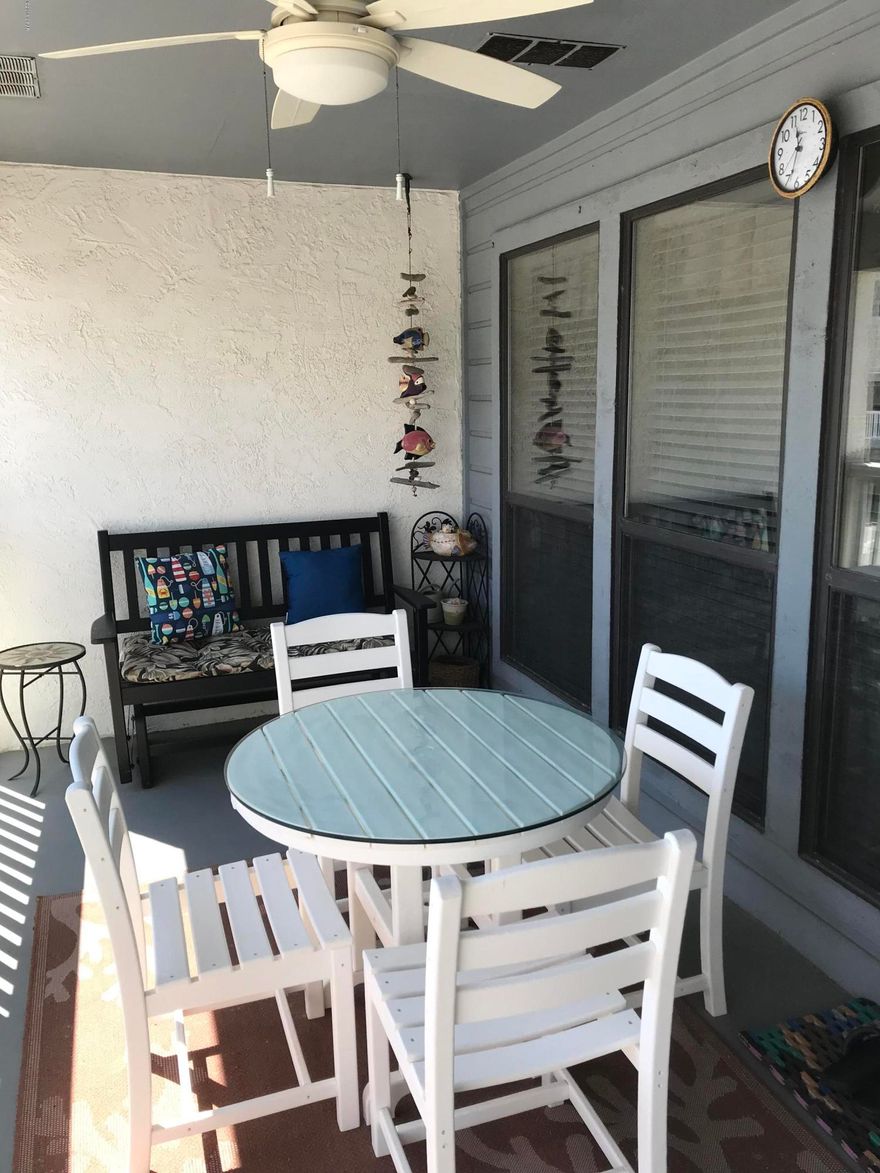 Back on the Market. This Condo is beautifully furnished and well maintained. Porch furniture is like new and this home has never been rented. AC Unit is less than 3 years old. Fantastic view of the Gulf from the back balcony and you can walk across the street to the sandy beach. Beautiful flooring which is insulated for soundproofing. Additional storage space is available behind the loft closet. Southwind will be undergoing a facelift which will include many exterior improvements. Please contact listing agent for details. All dimensions are approximate. Please verify if important. The flooring is absolutely gorgeous. The owners have identified items that do not convey. Among them are all items stored behind the loft through the small door opening.