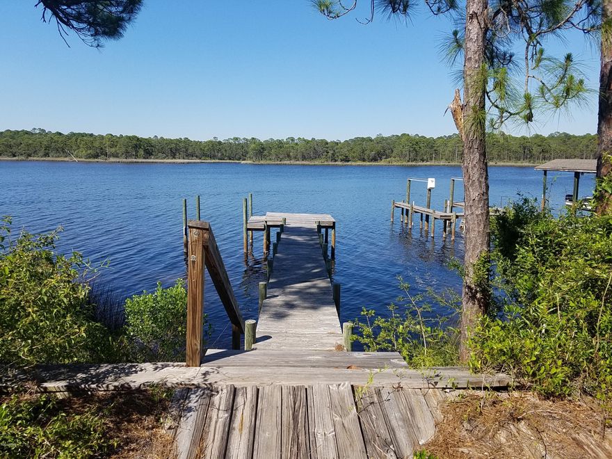 Hurry grab one of the highest elevated lots on Lake Powell! This 87 x 180 lot is wooded and has an existing seawall and dock. Located within close proximity to the Gulf and just minutes from Rosemary Beach and 30a.