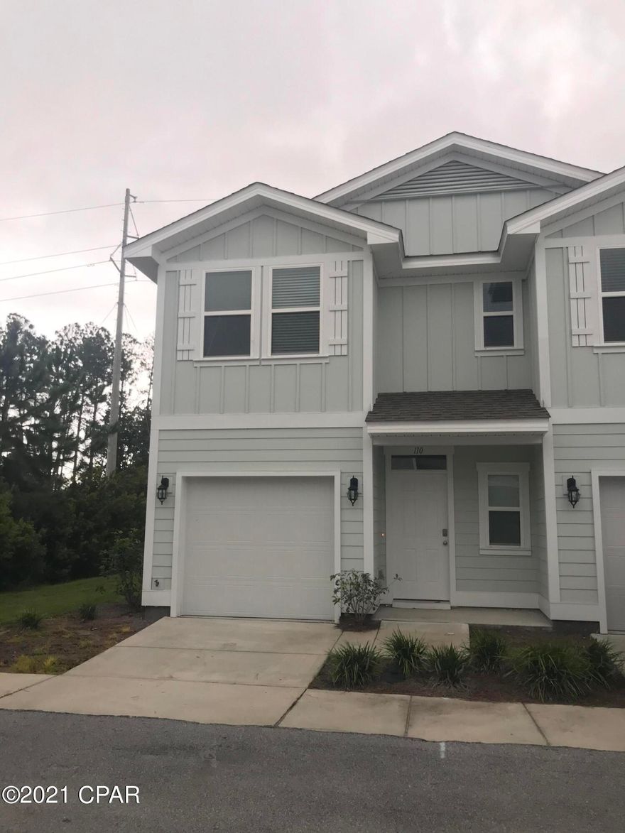 1.4 miles from the beach! This 3 bed 2.5 bath newer town home has granite counter tops and stainless appliances. Downstairs is an open floor plan living, kitchen and dining area with a half bath and a one car garage. Upstairs is a large master suite with walk in closet & bathroom with double vanity and tiled walk in shower. Two guest bedrooms, a guest bathroom and a closet with washer and dryer hookup are also upstairs. There is a small open patio out back and open land behind you for a beautiful view. This is an end unit so there is no one beside you and you have more windows. The pool and clubhouse are spacious and include parking. Only one car will fit in the driveway. There is a Smart Home Technology system installed that allows you to program your thermostat Lawn care is provided by the community. There is a dumpster for garbage disposal. Cluster mailboxes are located nearby for mail service. Utilities are the responsibility of the tenant.  $2200 per month and $2500 security deposit.  There is no washer and dryer provided.
