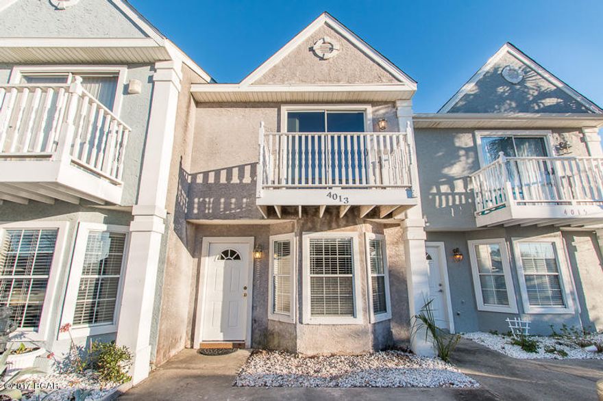 Location, location, location! Less than 700 ft away from a public beach access. This townhome is not only seconds away from the beautiful water, it's also been updated with new flooring in the kitchen and bathrooms, as well as new interior paint throughout. You're also located in an area that has low traffic and busyness during spring break and the summer months. This home would make a perfect vacation home for when you need to get away, or use it for a rental and put some extra money back in your pocket. The options are endless with this property. The owner has just spent money sprucing up the back yard, giving you a great area for a pet or to barbecue with friends and family. A brand new A/C was just installed as well so you don't have to worry about the added expense years after you purchase your new place. This location, for this price, will surely have this one sold quickly so don't waste time! Pick up the phone and call us today!!