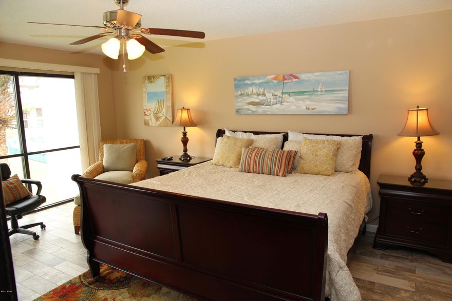 Beautifully furnished top floor condo with BEAUTIFUL WOOD-LOOK TILE FLOORING.   Very close to the tennis courts.  FULLY FURNISHED.  Views from the back to a small lake and one of the many pools in Edgewater.  Edgewater ownership allows the owner to play golf on the 9 hole course that weaves through the community.