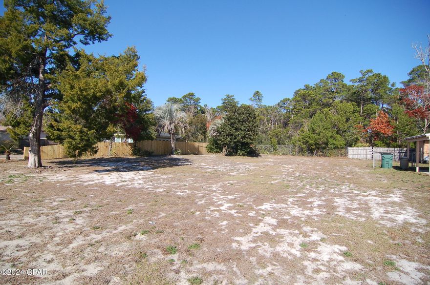 Looking for a lot on which to build your dream home?  Builders be alert!  This cleared residential lot  is located on the desirable west end of Panama City Beach.  It is one of the few building lots remaining available  in this area of the beach.  No HOA fees in this community!  This is a great location less than 2 miles from the beach, and near Pier Park, the 30A Corridor, and the NW Florida Beaches International Airport.  Larger than it looks, the lot extends 10 additional feet past the back fence line.   It is not in a flood zone (zone X per Bay County Property Appraiser site).  Survey available.  The Utility lines are in place which will save you time and money when you are ready to build a home.  Act now-make this one yours!