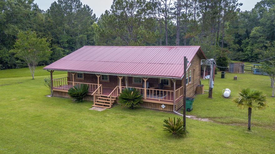 Nice Cabin feel to this over 5 acre Get-A-Away! The rustic feel to this new construction home displays an inviting Front Porch. The hard wood floor, ceilings, and walls gives the distinct appearance of a log home with the log home maintenance. Come and get a way from the hustle of town and enjoy a quite Hobby Farm complete with 50x36 Metal Storage Building and Livestock Barn. The property can be increased up to approximately 90ac by acquiring the adjoining list.
