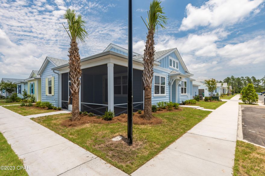 The Aloha Cottage is one of the largest & most popular designs available in Latitudes Margaritaville. Why wait 2 yrs when you can move in tomorrow? Numerous upgrades make this a great opportunity.  Screened porch, extensive recess lighting throughout, along with upgraded window sills are just the start. Quartz kitchen counters w/bullnosed edges & in the both bathrooms. Master bath includes floor to ceiling tiled shower w/ seamless door frame, tile floors & upgraded cabinets with drawer stack.  Glass front and porch entry doors add to the natural lighting that bathes the home.  The garage is wired for golf cart charging & has a utility sink.  The are numerous additions and upgrades to this home that can be found in the document section.  Seller is a licensed Florida Real Estate agent.