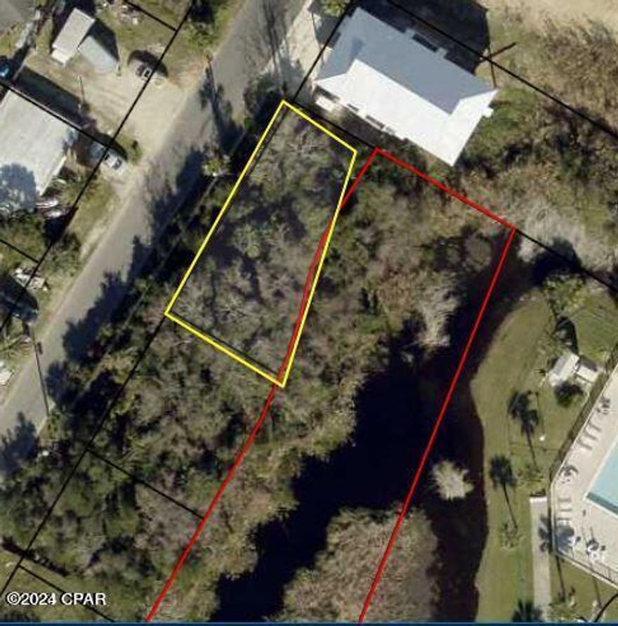 Build your home and guest quarters on this waterfront lot. Zoning R2 allows for two homes, X FEMA Zone means no extra permits or studies. This is a pond front lot near the beach with easy access to LAGUNA DEDICATED BEACH. Walk to the Carousel, Thomas Donuts, live in the sea air! Golf cart neighborhood with beach minded people, short-term rentals, vacation rentals allowed. This is a sweet piece of paradise, come see for yourself and dont hesitate to make an offer today!