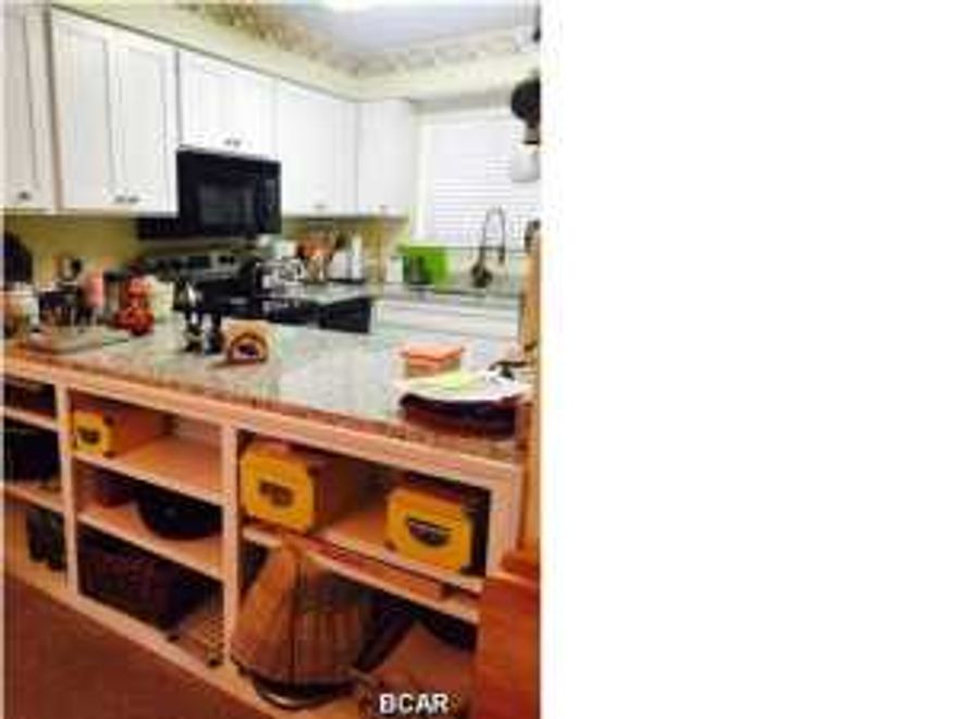 This furnished 2 bedroom condo is move-in ready, just in time to enjoy the summer! This unit has 2.5 baths and is a ***NON-RENTAL.*** This unit is poolside and the roof was recently replaced. The kitchen has been remodeled with granite countertops, new appliances, refaced cabinets and built-in custom shelves. The A/C compressor was replaced in 2014 and has been regularly maintained and checked twice a year. TV cable jacks have been added to each room. The master bathroom was remodeled with new fixtures and cabinets. The electrical system was updated with added circuits. New decks were built, front and back, up to city codes using 6x6's. This 16-acre condo complex consists of townhouse-style units on HOA-maintained grounds. Portside has 3 pools (one heated), 3